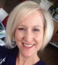 photo of Amy White, blond woman smiling